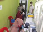Pastikan Kegiatan Aman dan Kondusif, Polsek Kuala Kampar Lakukan Pengawalan Vaksinasi Covid-19.